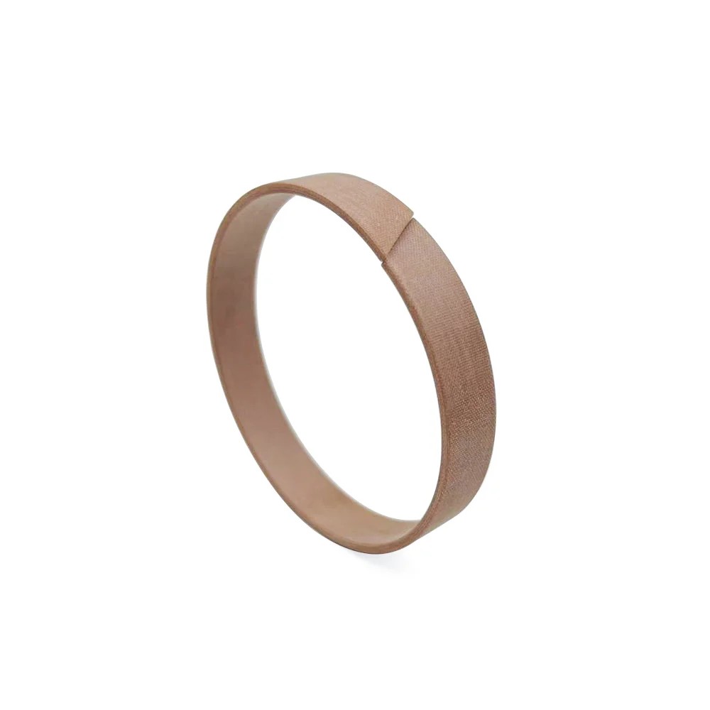 Phenolic resin with fabric wear rings for hydraulic cylinder guide support