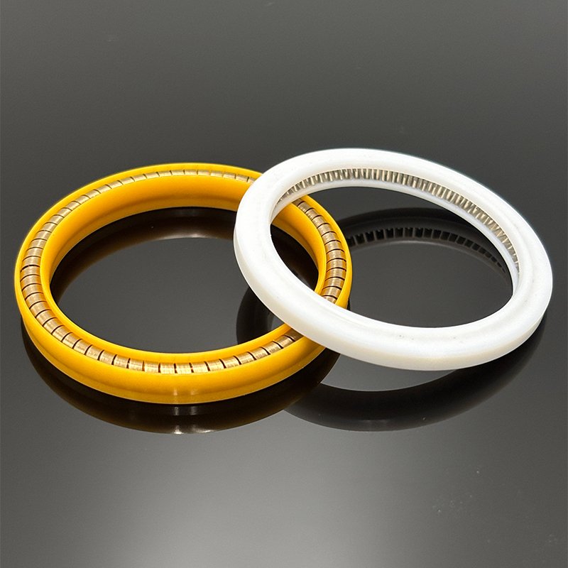 Internal metal energizer spring design for spring energized seals